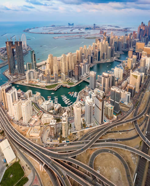 Aerial view of business bay in Dubai and the palm with expressway ,Uae